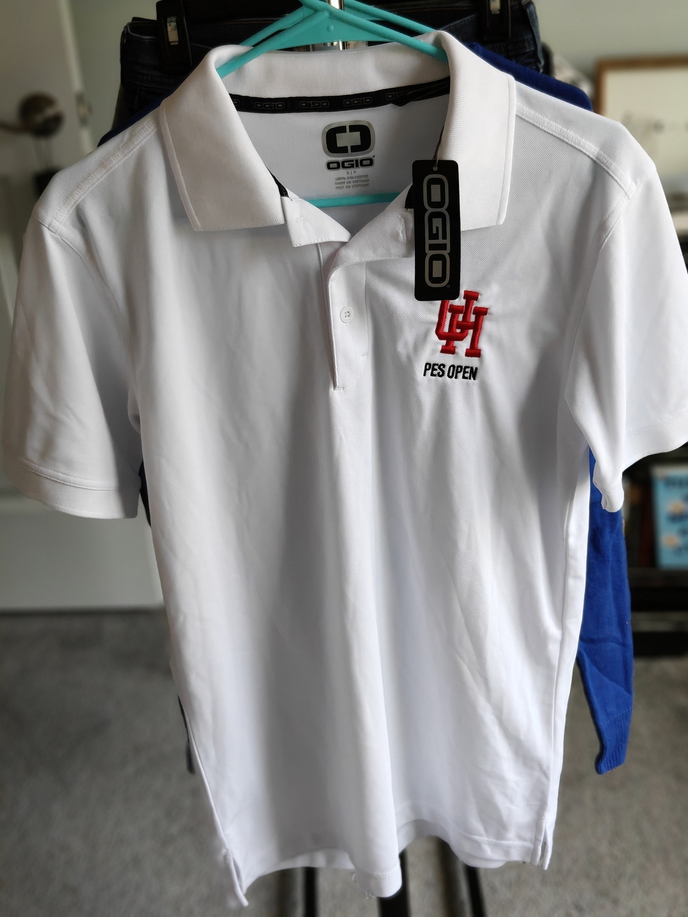 OGIO White Mens Polo with Red UH PES Open Embroidered Logo